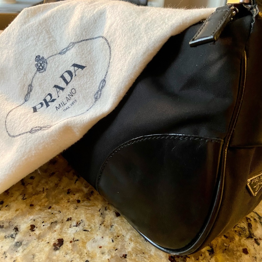 Prada satin bag with leather on sides.